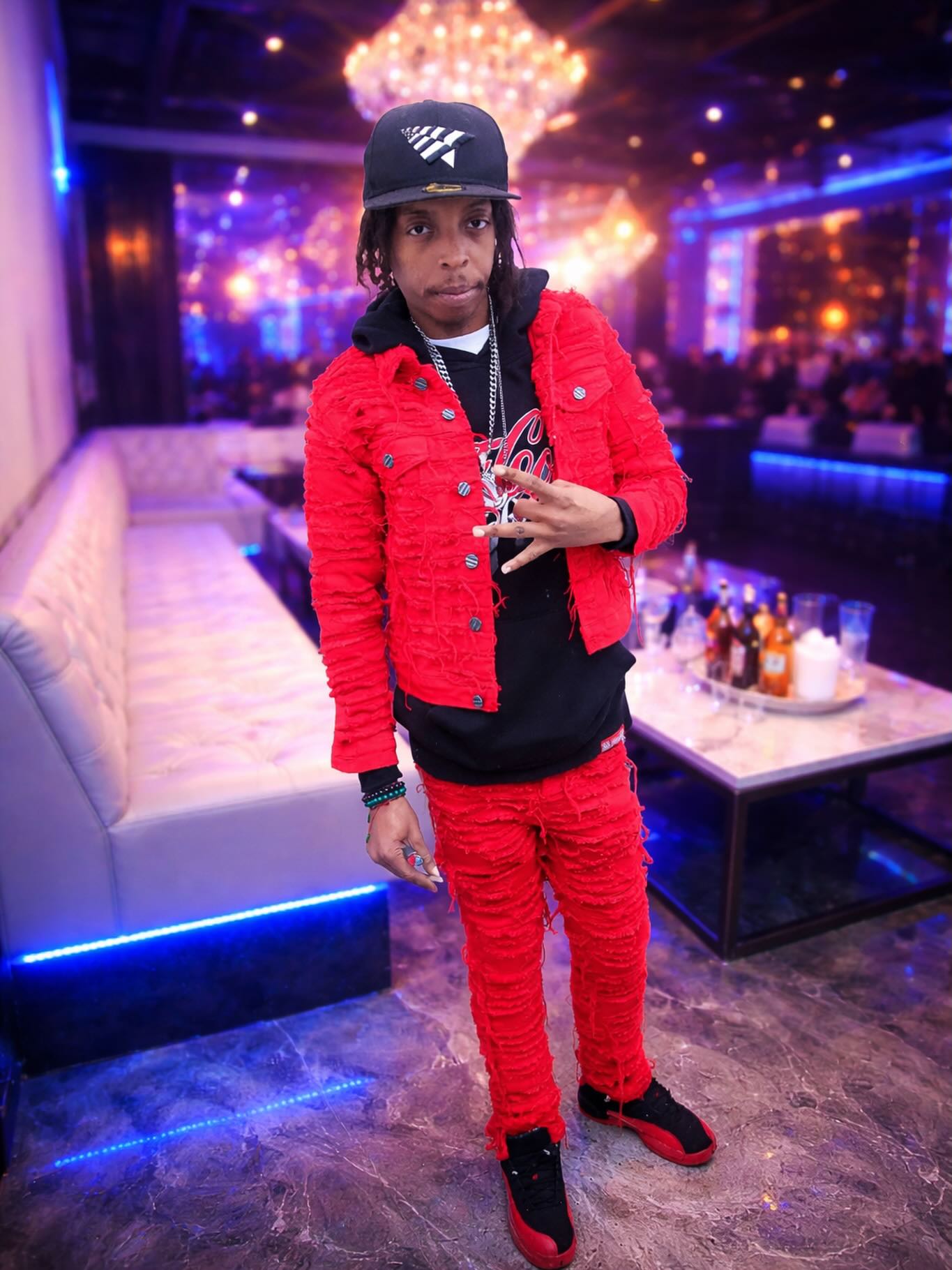 Shorts Temper in his red-and-black outfit